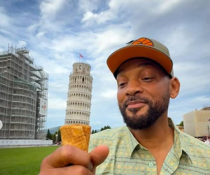 Will Smith "mangia" la Torre di Pisa:  la star di Hollywood si gode la Toscana  e fa impazzire i fan